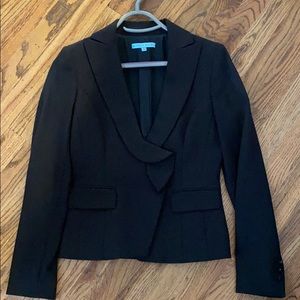 Black suit. Includes both jacket and skirt